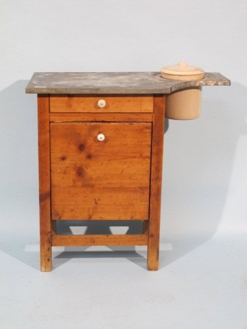 Texas Pine Baker's Work Table, 19c.: Texas pine baker's or pastry work table, 1860-80, lightly stained yellow pine, construction sheet zinc covered work surface, with cut off for ceramic crock with lid, the case fitted with a small drawe