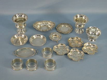 Lot of 17 Assorted Sterling Silver Items: Lot of 17 Sterling Silver Items: 4 Napkin Rings marked Lunt Sterling; 4 Small Four Leaf Clover Design Dishes 2 1/2"D marked Lenox Silver Inc Sterling; Two Toothpick Holders marked Sterling; Two Round