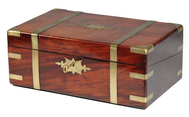 Mahogany lap desk: Walnut box with nice grain reinforced with brass corners and braces. A brass escutcheon with key in front and brass plaque on top inscribed, “Saml. Fiske 1850”. English, d. 1850. H 6.25” | W 16�
