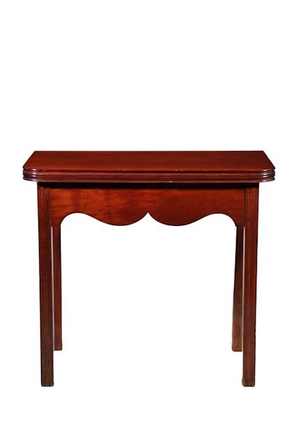 Rare mahogany Chippendale card table: A diminutive size with deep scalloped apron creates a dramatic appearance. The top is molded and the table has straight molded legs. Probably English, c. 1780. H 28.75” | W 32” | D 17” [ Open 34