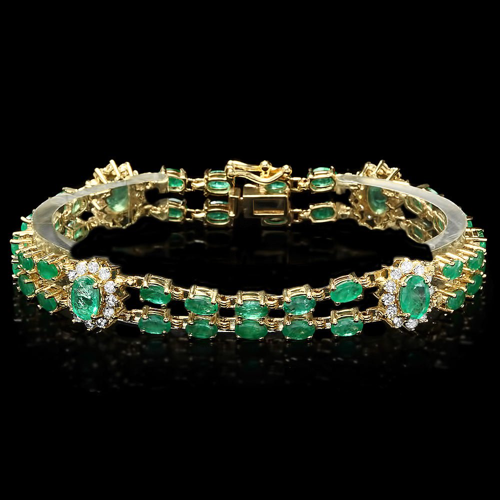 14k Gold 12ct Emerald 1.50ct Diamond Bracelet: This magnificent ladies bracelet is crafted in solid 14k Yellow Gold and features 42 (12.00 ctw) 100% Natural Emeralds mined from Colombia + accented with 48 sparkling eye-clean natural diamonds, tota