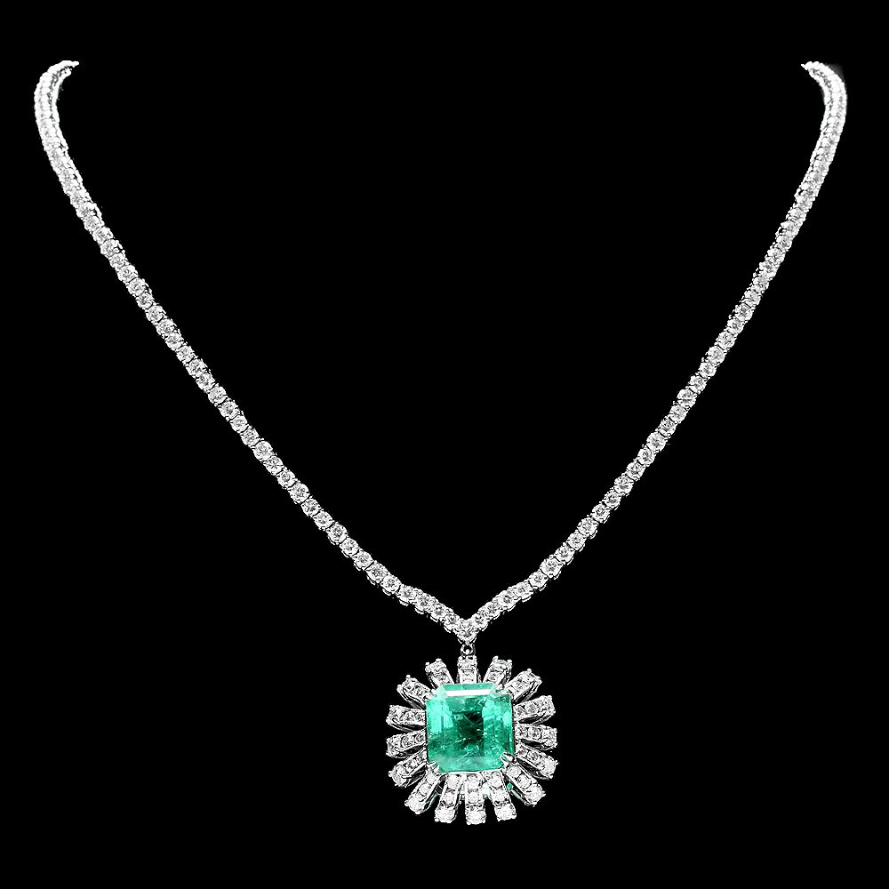 18k Gold 9ct Emerald 11ct Diamond Necklace: This luxurious ladies necklace is crafted in solid 18k White Gold and features a 9.00 carat 100% Natural Emerald mined from Colombia + accented with 204 sparkling eye-clean natural Diamonds, totaling 