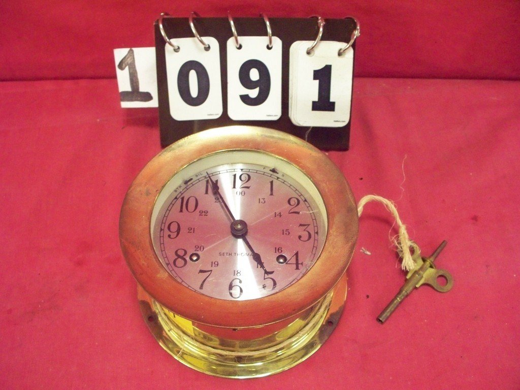 WALL MOUNT BRASS CLOCK - SETH THOMAS - 1004 CORSIR E: WALL MOUNT BRASS CLOCK - SETH THOMAS - 1004 CORSIR E 537-000 - WIND-UP CLOCK WITH KEY - 3'' x 5.5''