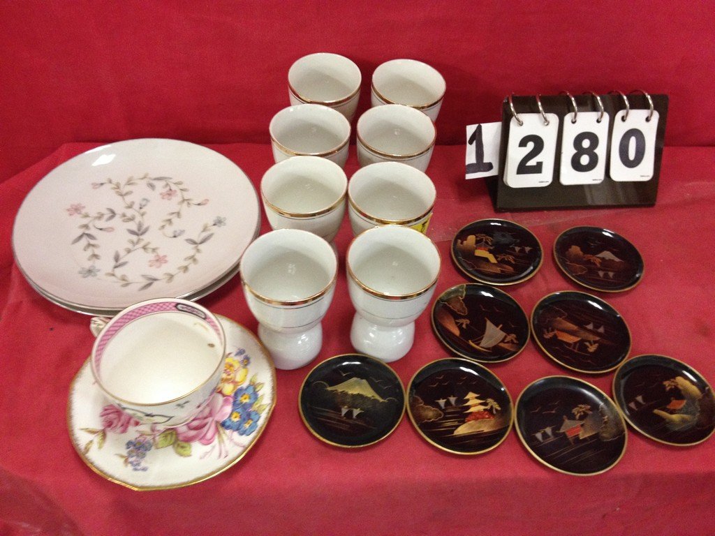 LOT OF 19 - 7 EGG CUPS GOLD TRIM (TWO WITH CHIPS ON: LOT OF 19 - 7 EGG CUPS GOLD TRIM (TWO WITH CHIPS ON LIP)- 8 COASTERS BLACK ORIENTAL(RESIN) - 1 CROWN STAFFORDSHIRE ENGLAND CUP - 1 ROSIGN CHINA SAUCER - 2 HARMONY HOUSE FINE CHINA PLATE