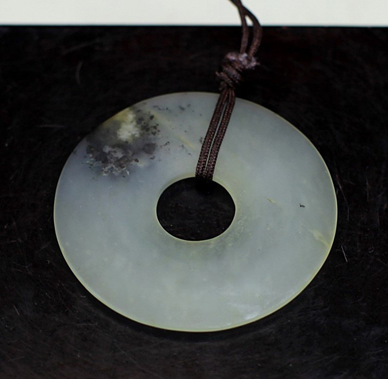 JADE BI: Diameter: 2.25 inch. This item was consigned by The Rhode Island Amitabha Buddhist Assocation, and all commission will be donated to the Rhode Island Amitabha Buddhist Assocation.