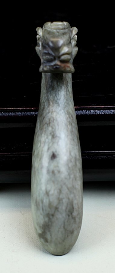 JADE BELT HOOK: 19th Century. Length: 2.75 inch. This item was consigned by The Rhode Island Amitabha Buddhist Assocation, and all commission will be donated to the Rhode Island Amitabha Buddhist Assocation.