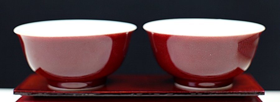 PAIR OF RED GLAZED PORCELAIN BOWLS: Diameter: 4.5 inch, Height: 2.25 inch. This item was consigned by The Rhode Island Amitabha Buddhist Assocation, and all commission will be donated to the Rhode Island Amitabha Buddhist Assocation.