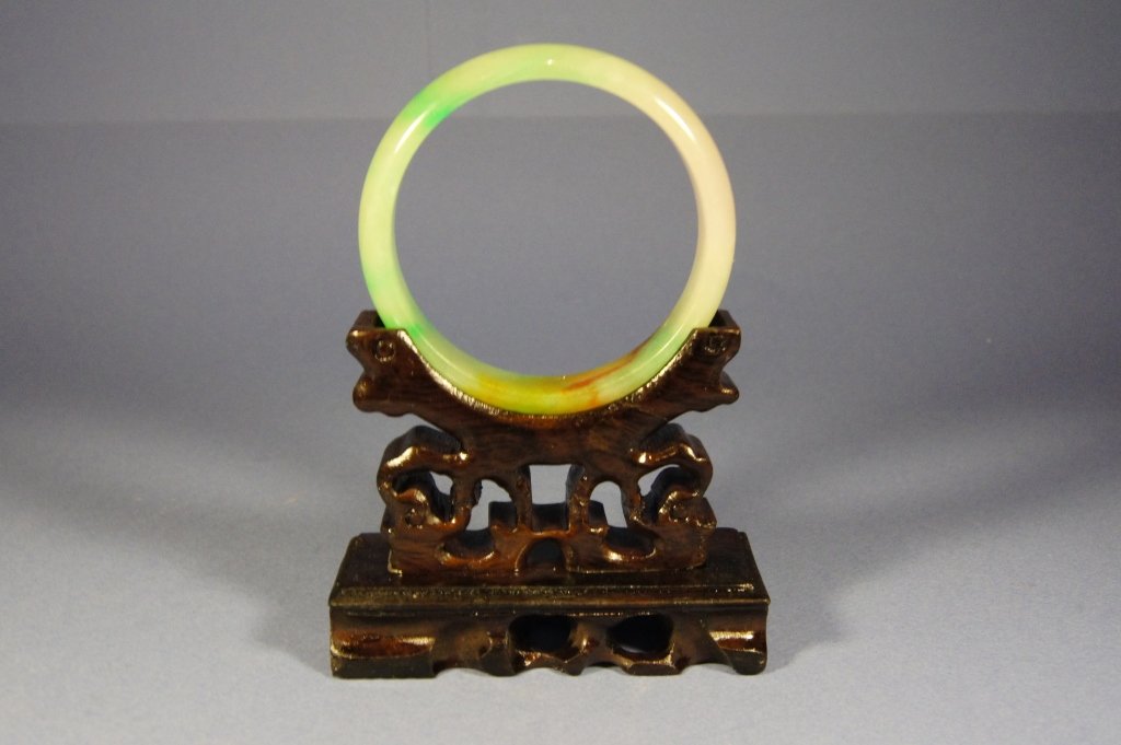 Chinese antique apple green jade bangle: Chinese antique green jade bangle, brown infusion, stand not included, D: 7.3