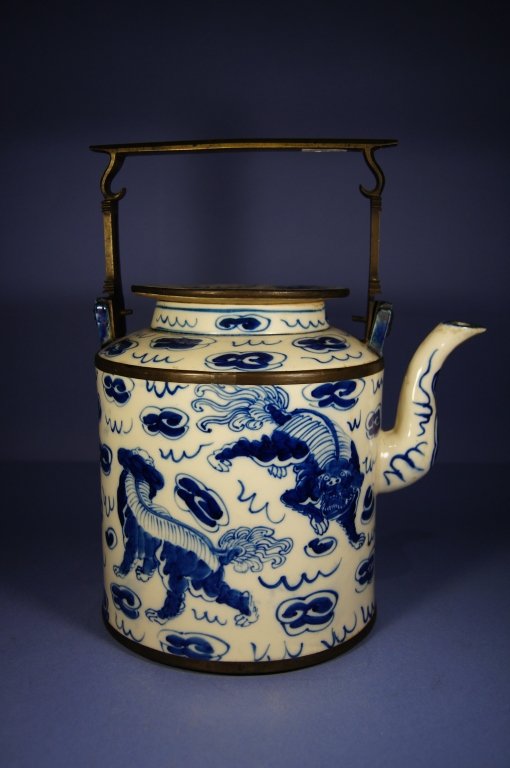 Japanese antique blue and white porcelain pot: Japanese antique blue and white porcelain tea pot with metal handle ; early 20 th C ; H: 28.8 cm