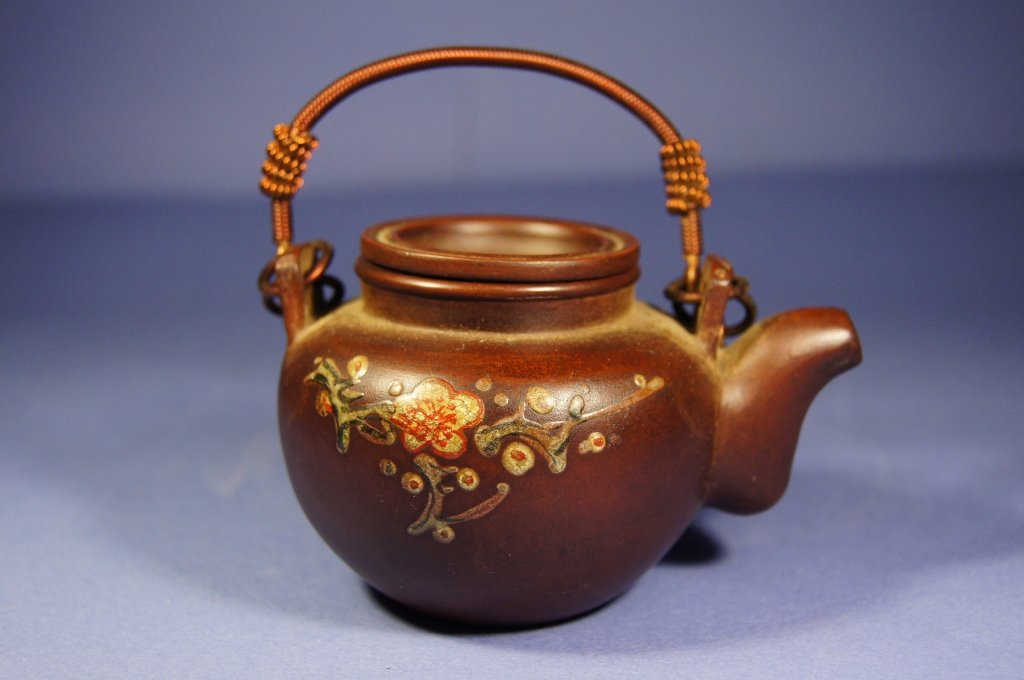 Chinese antique Yixing Tea pot: Chinese antique Yixing Tea pot ; Floral pattern with color ; Double metal handle ; stamped cover and bottom ; H: 6.3 cm ,W: 10 cm