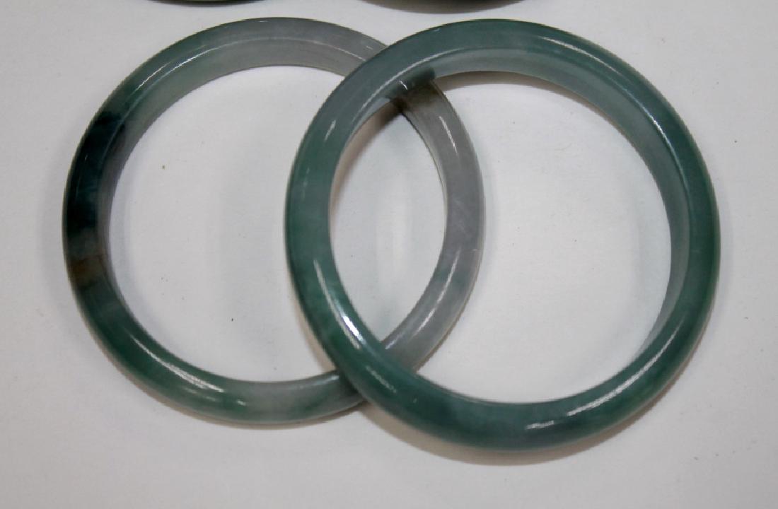 Lot of 4 Carved Jade Bangles: Lot of 4 Carved Jade Bangles