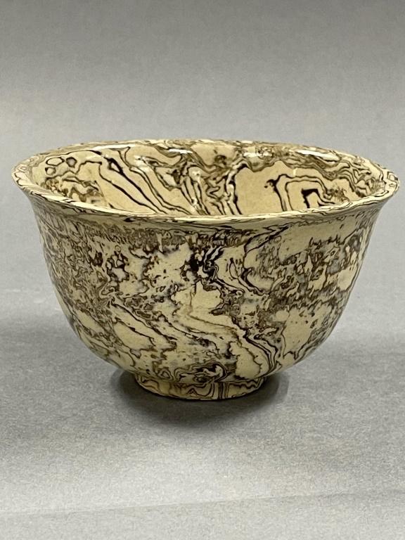 A Marbled Earthenware Bowl: D: 12cm