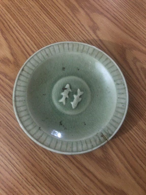 A celadon plate: A celadon plate