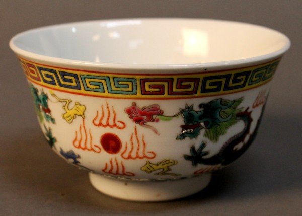 A Chinese Wucai Porcelain Bowl: Chinese Wucai porcelain bowl * Decorate with colorful dragon , Mark on the bottom, Qing dynasty * Size: 2.5'' x5'' Starting Bid: 75