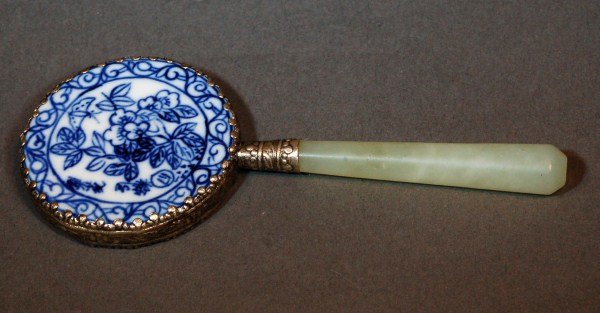 Chinese Blue and White Mirror with Jade Handle: Chinese blue and white porcelain mirror with jade handle. sentence with painting of pear flower attract butterfly. Size: L5 1/4'' with handle D2 1/4 mirror Starting Bid: 50