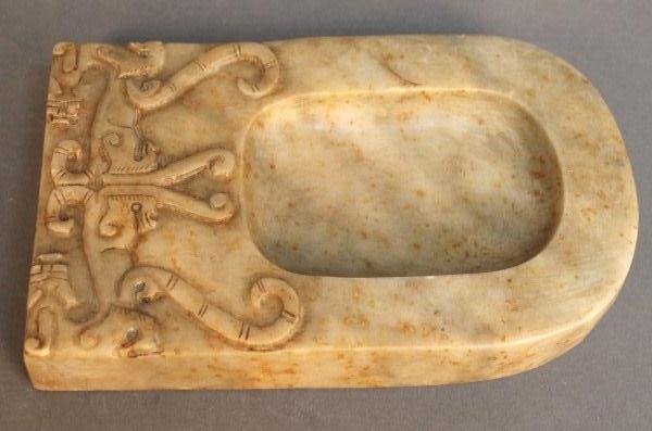 A Chinese Jade Inkstone: A Chinese jade Inkstone. Size: H 7'' . W 4 1/4'' Starting Bid: 100