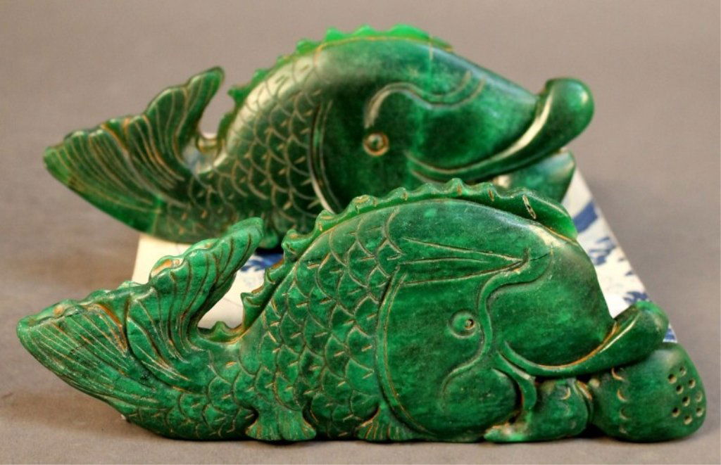 Two large Chinese Jade Decorative Pieces: Two large Chinese jade decorative pieces , design with fish having lotus in the mouth. Size: 7.75"x3.25" Starting Bid: 150