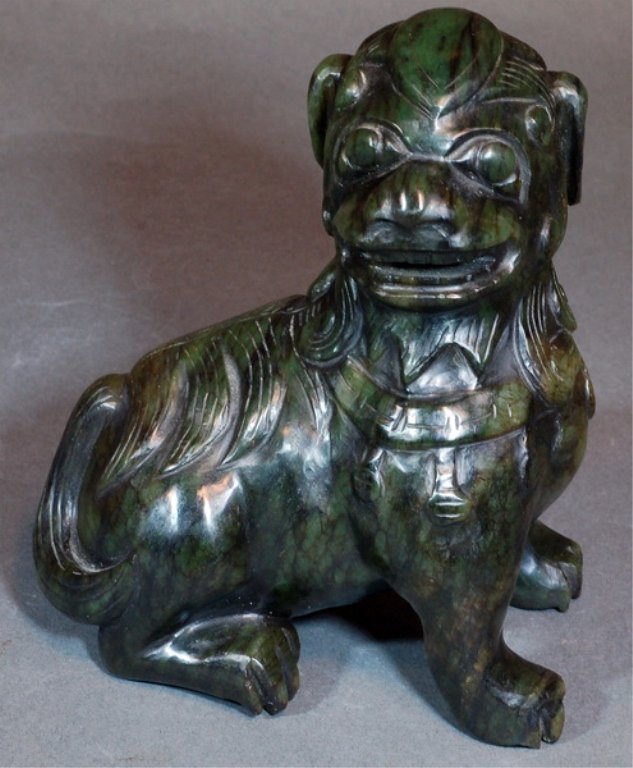 A Nice Carved Celadon Jade Ornamental Piece--Dog: A nice carved celadon jade ornamental piece in the form of dog. Width: 5" , Length: 3" , Height:7". Starting Bid: 300