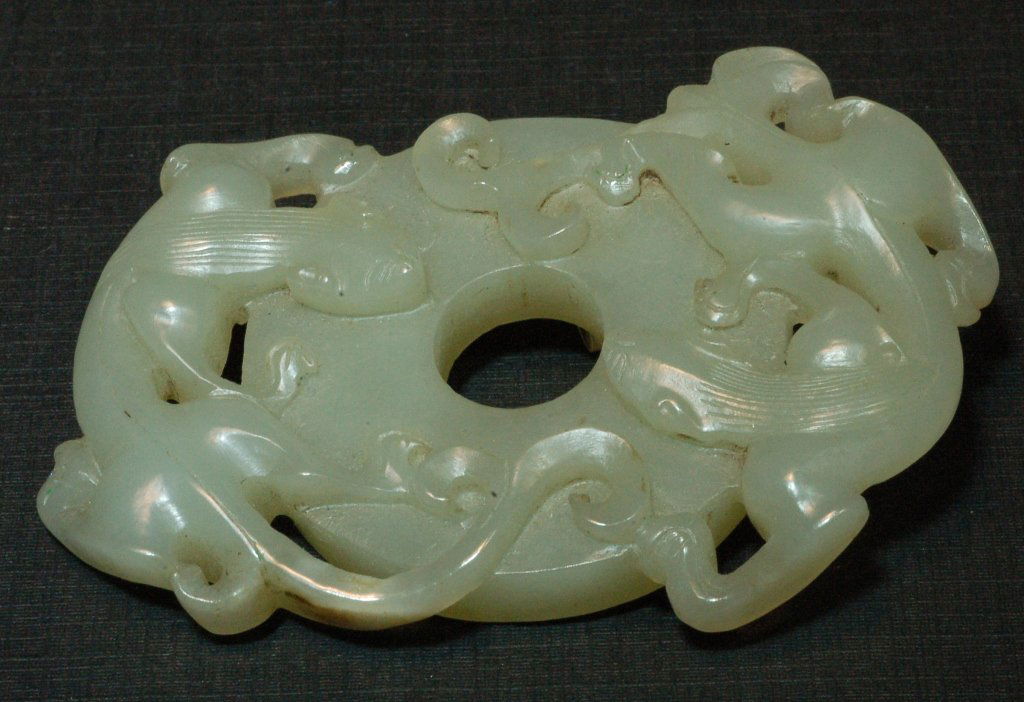 Chinese Qing Carved Celadon Jade Pendant: Chinese Qing finely carved celadon jade pendant , with two baby dragons playing. Ex-collection from a local collector bought during 1980's. Size: L2" W3" H1/4" Starting Bid: 400