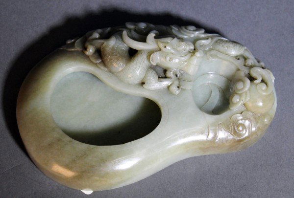 Large Chinese Jade Brush Washer: A large Chinese antique brush washer of white jade, depicting dragon with cloud pattern on the side. Qing Dynasty. Ex-collection from a local collector bought during 1980's. Size: L4" W6 1/2" H1" Star