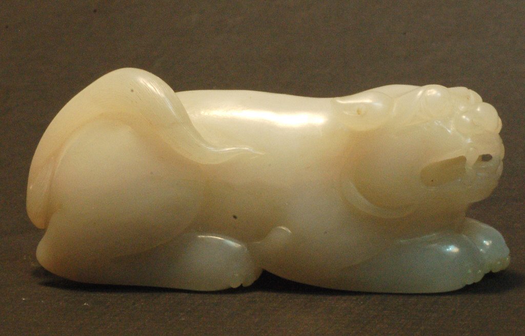 Chinese Old White Jade Badger: A finely carved old Chinese white jade in the form of badger. from collection of a local collector bought during 1980's. Size: L1 1/4" W 3 1/2" H1/2" Starting Bid: 1500