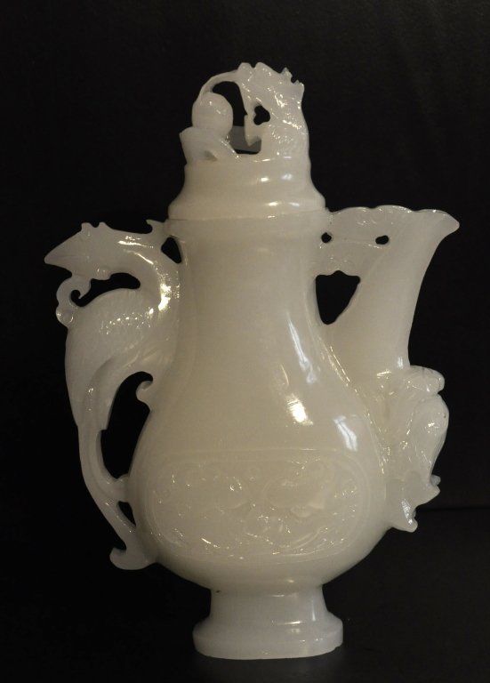 Chinese White Jade Wine Bottle: Chinese White Jade Wine Bottle, carved with dragon and phoenix pattern. . Size: L 1 1/2" W 6 1/2" H " Starting Bid: 250
