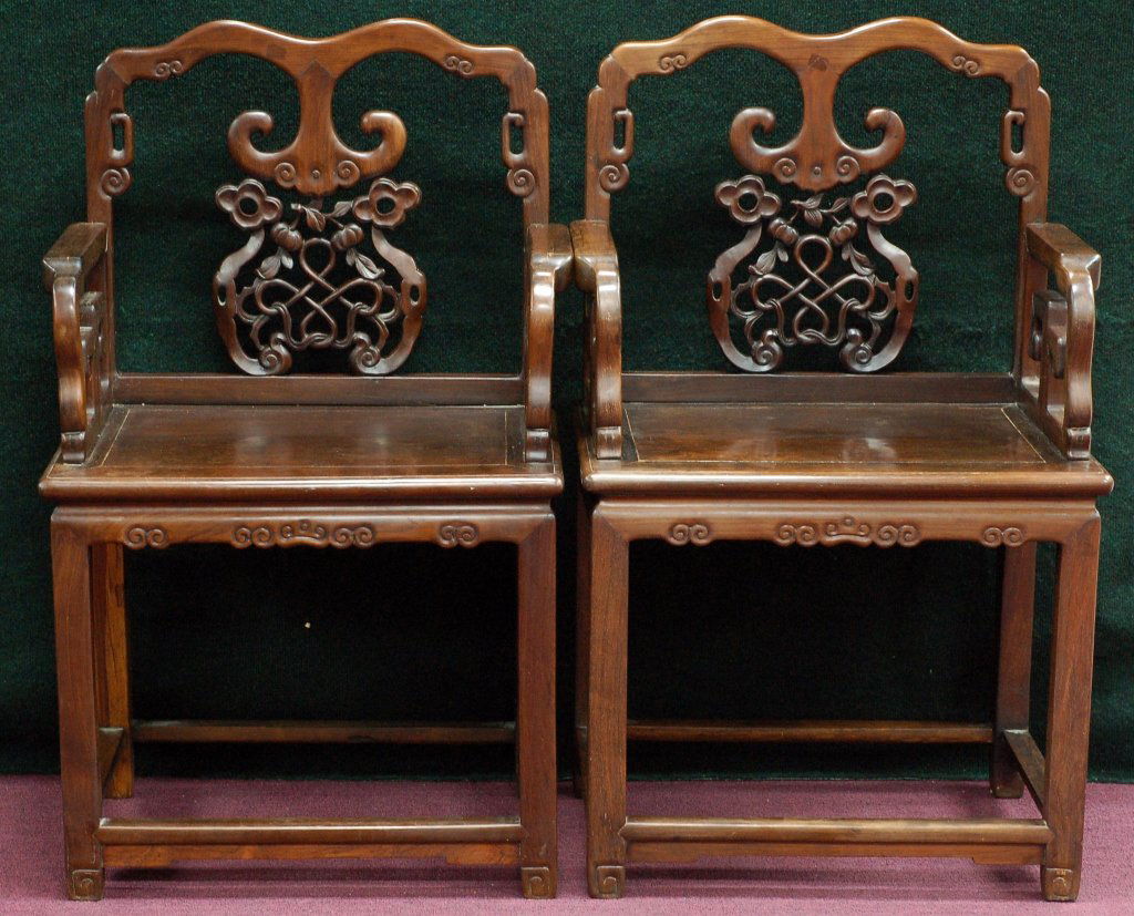 Pair of Chinese Qing Rosewood Arm Chairs: Pair of Chinese Qing Rosewood Arm Chairs. Highly carved backs. From the estate of private collector , Houston, Tx. Size: L19" W25" H38" Starting Bid: 800
