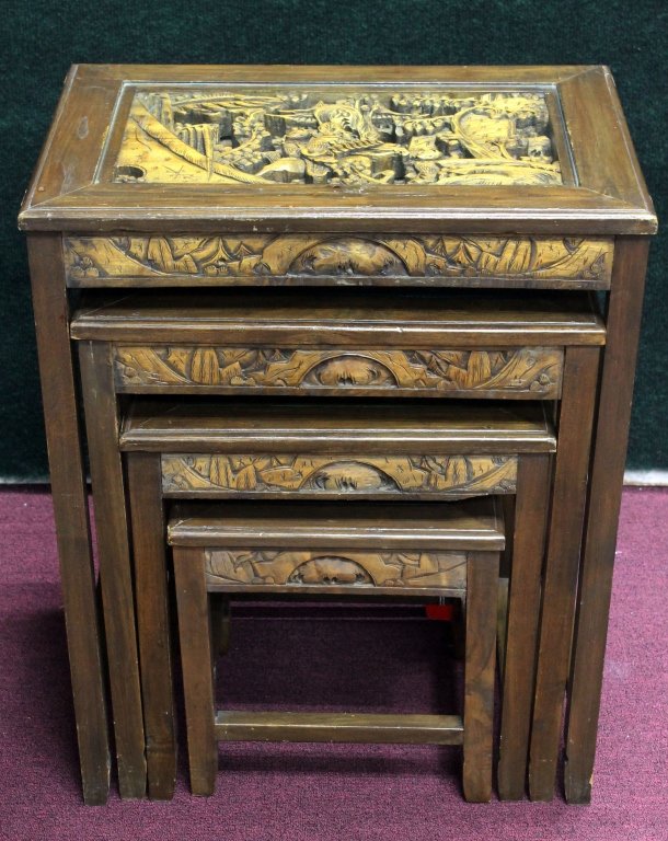 Set of 4 Chinese Nesting Tables: Set of 4 Chinese Nesting Tables, each having a detailed scene carved into the top with glass covering the carving. Size ; W20" H24 1/2 Starting Bid: 100