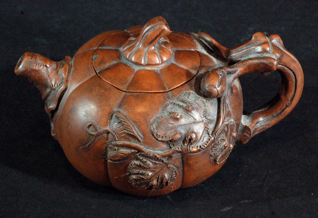 Chinese Yixing Zisha Teapot: 4 character mark to the base. Size:W:5" H:3 1/2" Starting Bid: 100