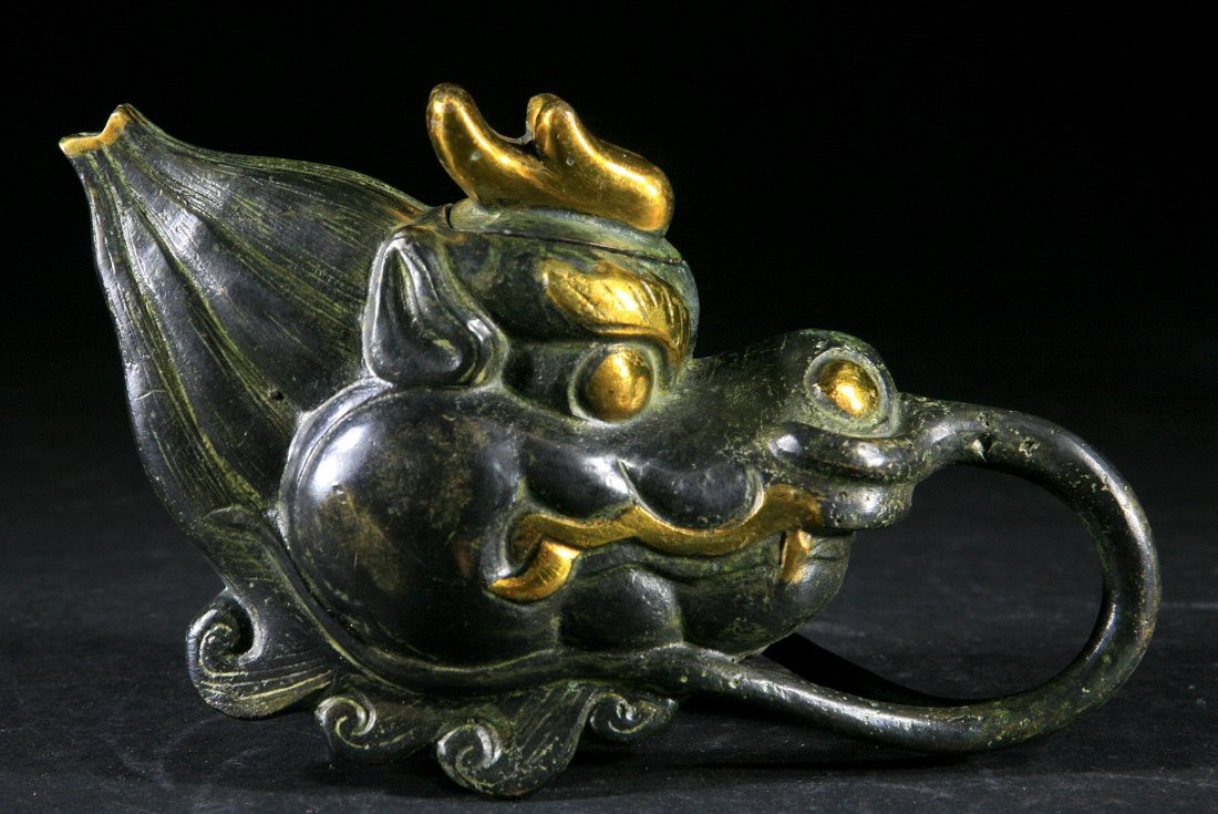 Antique Dragon-head Shaped Bronze Teapot: Gilt and 4 characters to the base. Size:L:7 1/2â€ Starting Bid: 100
