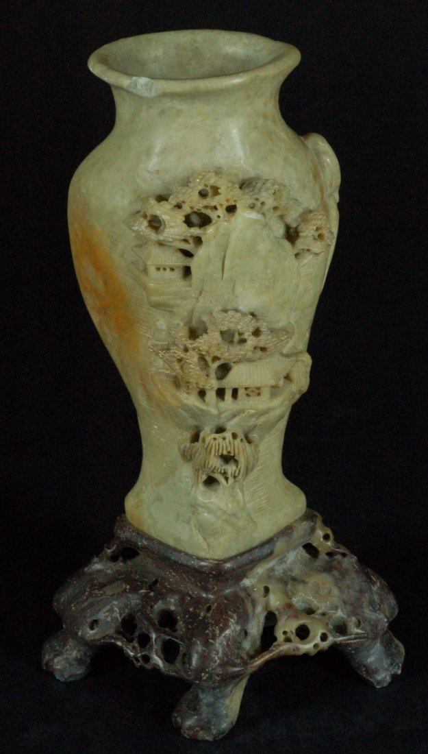 Highly Carved Soapstone Vase on Base: Intricately carved soapstone scene of a village. Size:H:8" Condition:Tiny chip on the rim Starting Bid: 25