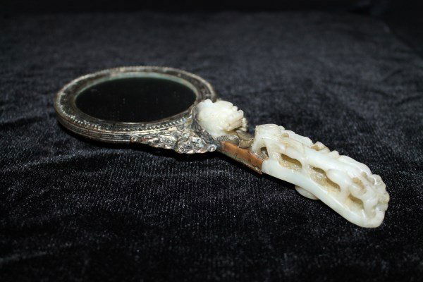 Carved Jade Ornamental Mirror: Jade belt buckle handle and jade insert to back. Size : 9" T From the collection of a local collector.