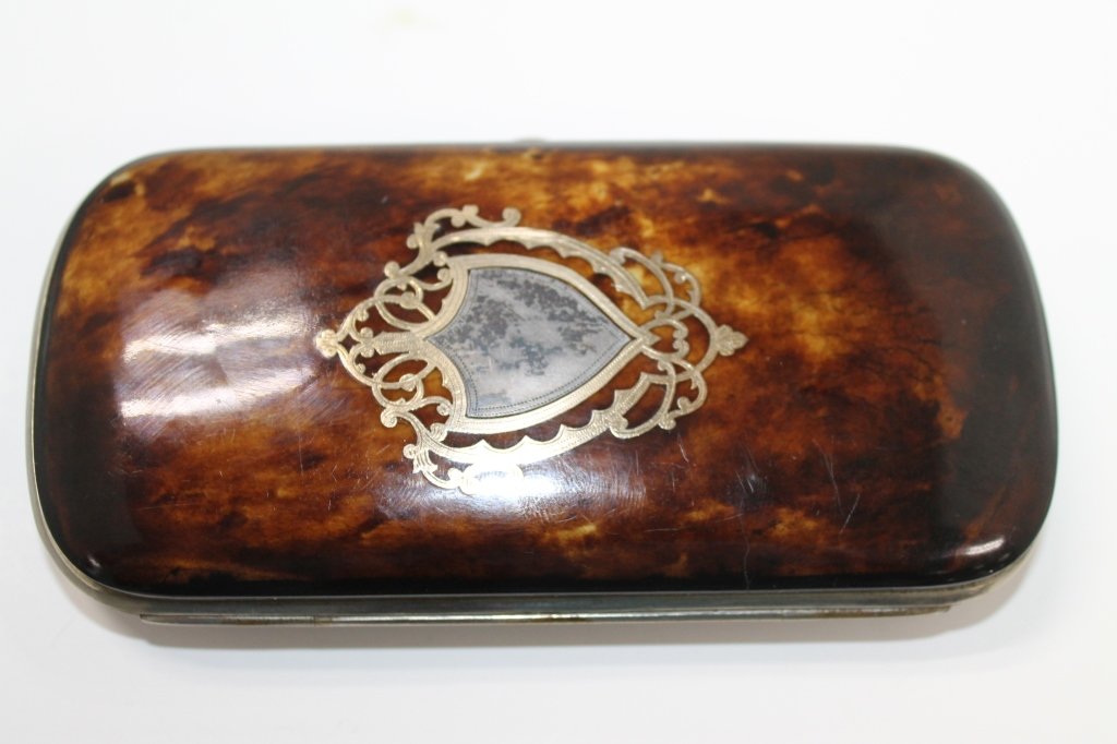 Continental Silver Inlaid Spectacles Case: Continental silver-inlaid tortoiseshell spectacles case with armorial crest to cover. Size: 5 1/2" L x 3 1/2" W