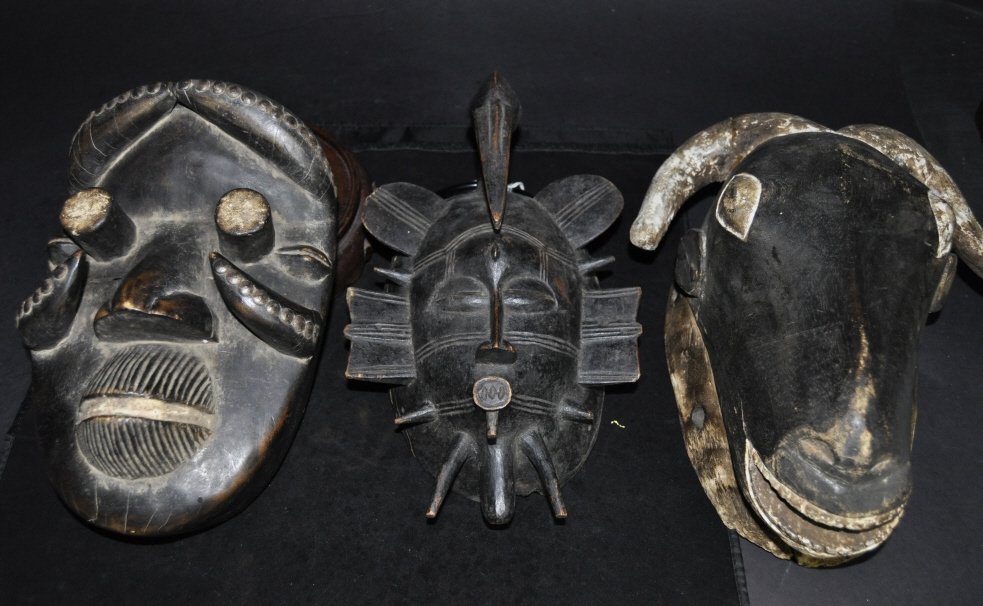 Three African Carved Wood Masks: Size: 12" x 10" (largest)