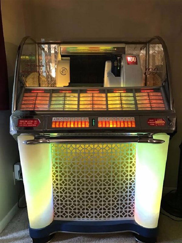 VINTAGE SEEBURG SELECT O MATIC 100 JUKEBOX CIRCA 1954,: VINTAGE SEEBURG SELECT O MATIC 100 JUKEBOX CIRCA 1954, IN VERY GOOD WORKING CONDITION, CONTAIN NUMEROUS 45 RPM RECORDS, WORKS WITHOUT COINS REQUIRED, 52"H X 35:W X 27"D, SKU359.01