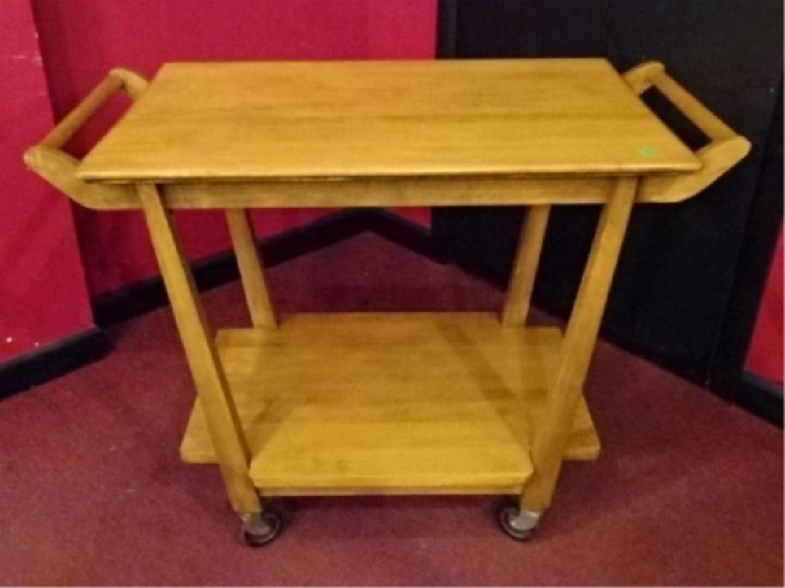 MID CENTURY MODERN SERVING CART, JOHN WIDDICOMB STYLE,: MID CENTURY MODERN SERVING CART, JOHN WIDDICOMB STYLE, WITH UNDER TIER AND CASTERS, VERY GOOD CONDITION, BLONDE FINISH, 36"W X 20"D X 27.5"H, SKU355.01