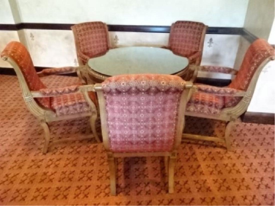 6 PC DINING OR GAME TABLE SET, ROUND GILT WOOD DINING: 6 PC DINING OR GAME TABLE SET, ROUND GILT WOOD DINING TABLE WITH DARK FINISH, 5 REGENCY STYLE ARMCHAIRS WITH MEDIUM FINISH AND RED UPHOLSTERY, #3 OF THREE IDENTICAL SETS AVAILABLE THIS AUCTION SOLD SE