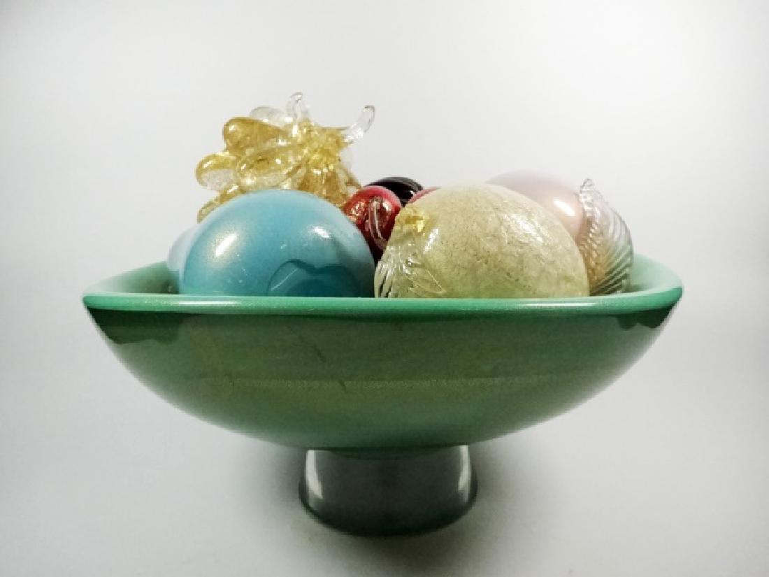 ART GLASS PEDESTAL BOWL WITH ART GLASS FRUIT, BOWL IS: ART GLASS PEDESTAL BOWL WITH ART GLASS FRUIT, BOWL IS GREEN WITH GOLD FLECKS AND CLEAR PEDESTAL BASE, FRUITS INCLUDE BANANA, GRAPES, LEMON & MORE. BANANA HAS CHIP TO ONE END. CHERRY STEMS CHIPPED/BROK