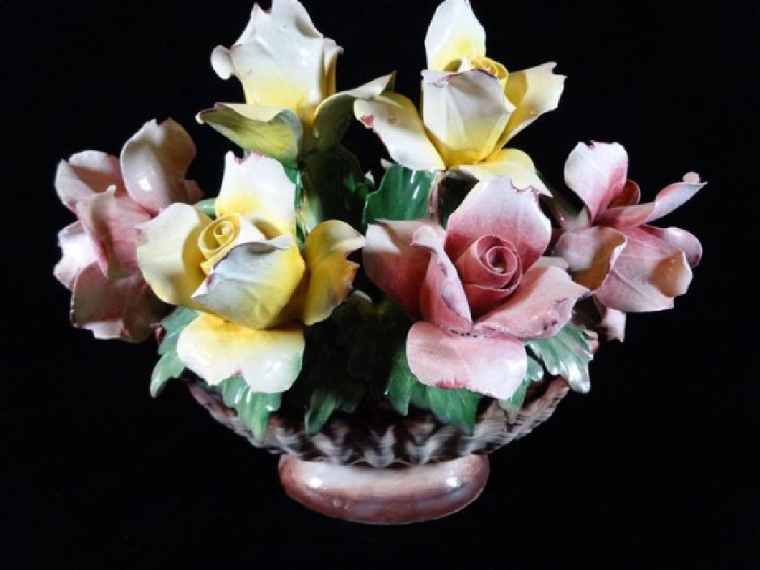 LARGE CAPODIMONTE ITALIAN PORCELAIN FLOWERS IN FOOTED: LARGE CAPODIMONTE ITALIAN PORCELAIN FLOWERS IN FOOTED BASKET, WITH N AND CROWN MARK, MADE IN ITALY, VERY GOOD CONDITION WITH A COUPLE MINOR CHIPS TO PETALS, 10H X 11"W, SKU454.23
