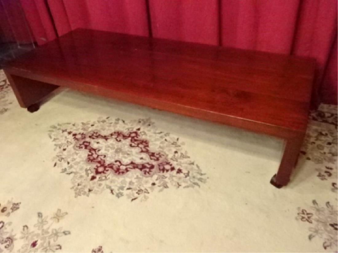 CONTEMPORARY WOOD COFFEE TABLE ON CASTERS, VERY GOOD: CONTEMPORARY WOOD COFFEE TABLE ON CASTERS, VERY GOOD CONDITION, 61"W X 25"D X 14"H, SKU413.01