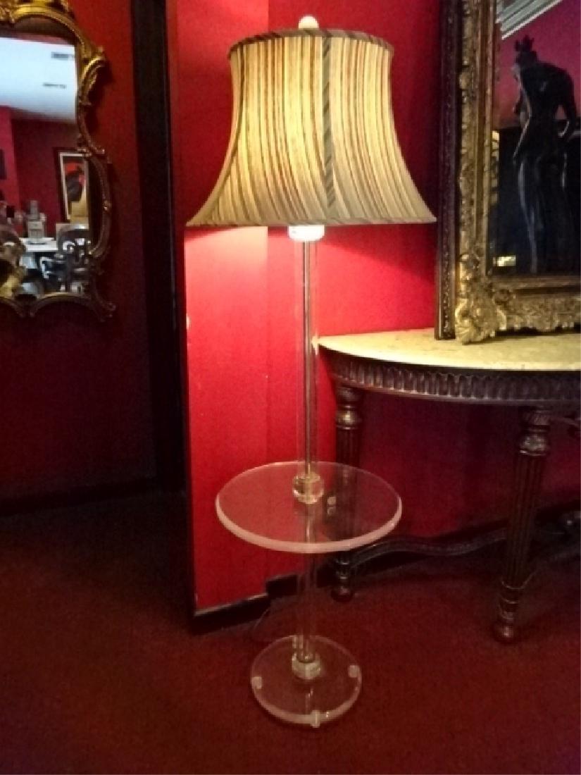 CLEAR LUCITE LAMP WITH TABLE ON ROUND CLEAR LUCITE: CLEAR LUCITE LAMP WITH TABLE ON ROUND CLEAR LUCITE BASE, VERY GOOD CONDITION WITH SOME LIGHT SCRATCHES ON TABLE TOP AND BASE, 62"H X 19"W, SKU486.02 P20