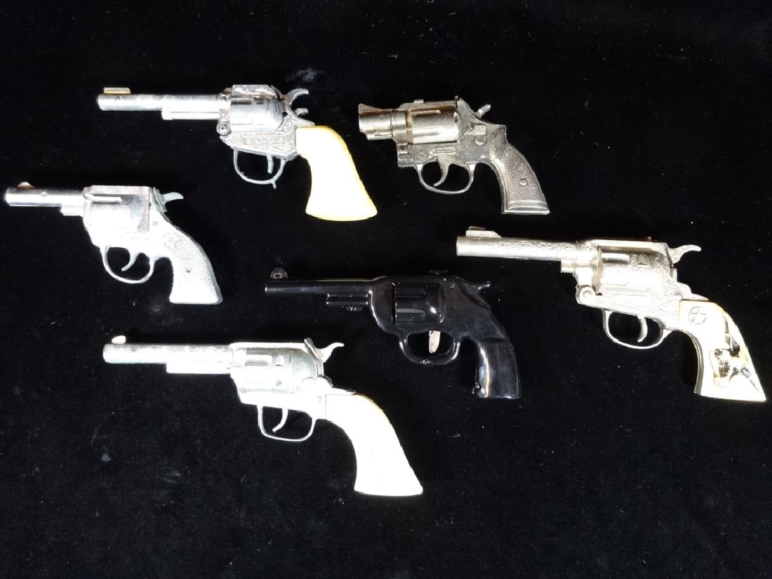 6 VINTAGE TOY CAP GUNS, METAL AND PLASTIC, MID CENTURY,: 6 VINTAGE TOY CAP GUNS, METAL AND PLASTIC, MID CENTURY, VERY GOOD VINTAGE CONDITION, UNTESTED, 7" X 4", SKU531