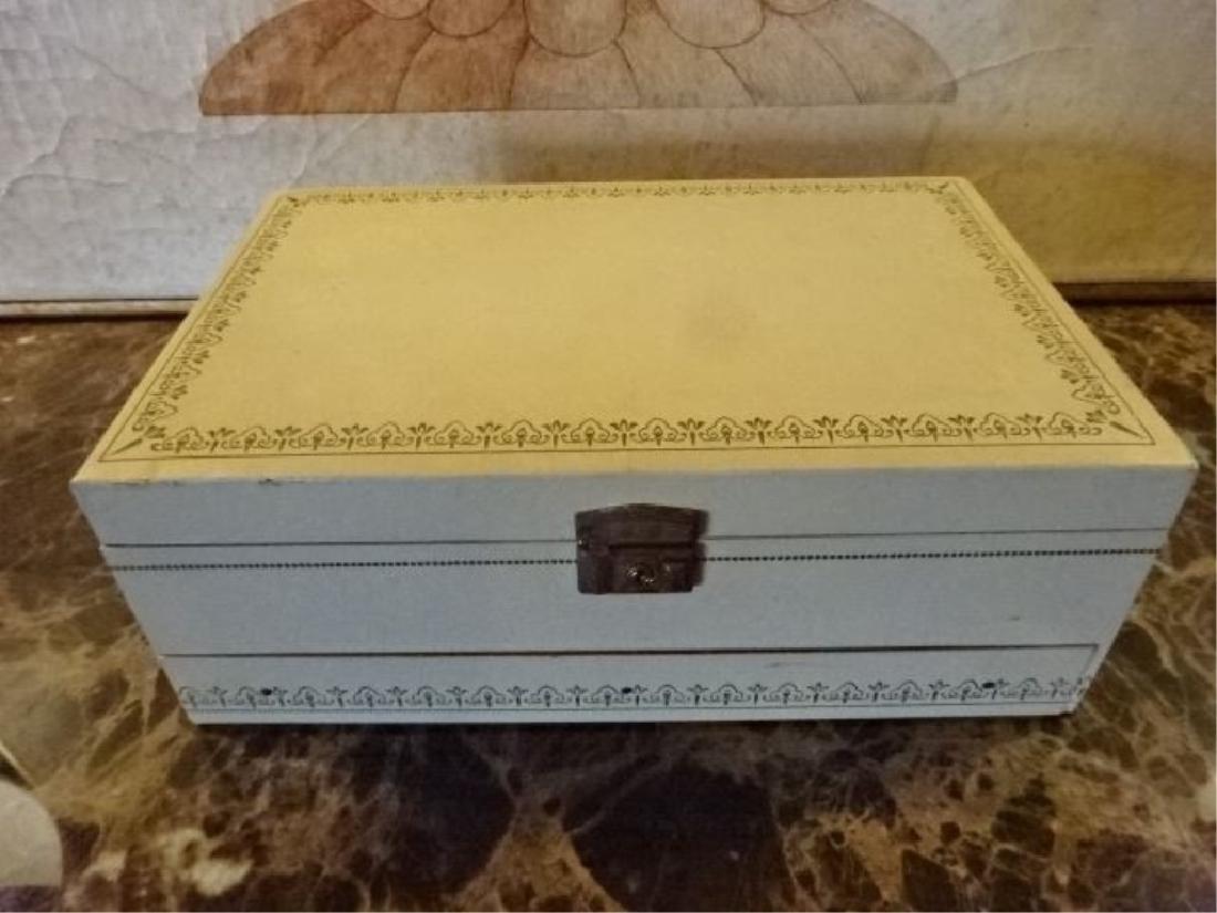 VINTAGE JEWELRY BOX, WHITE FAUX LEATHER WITH GOLD, RED: VINTAGE JEWELRY BOX, WHITE FAUX LEATHER WITH GOLD, RED INTERIOR, GOOD VINTAGE CONDITION WITH LIGHT WEAR AND ONE TEAR ON BACK (SEE PHOTO), 12.5" X 8" X 4.5", SKU529.01
