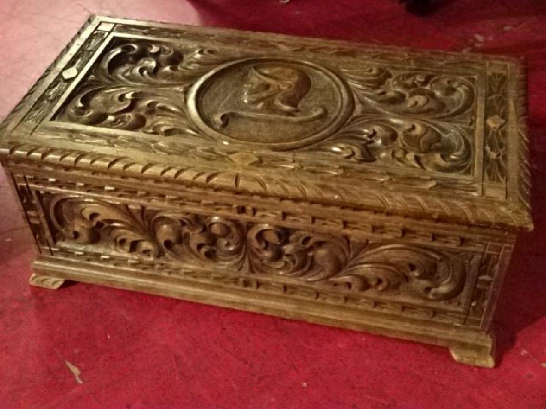CARVED WOOD CHEST WITH KNIGHT'S ARMOR AND CARVED: CARVED WOOD CHEST WITH KNIGHT'S ARMOR AND CARVED FOLIATE DESIGNS VERY GOOD CONDITION, 29.5" X 15.5" X 11", SKU556.47 P30