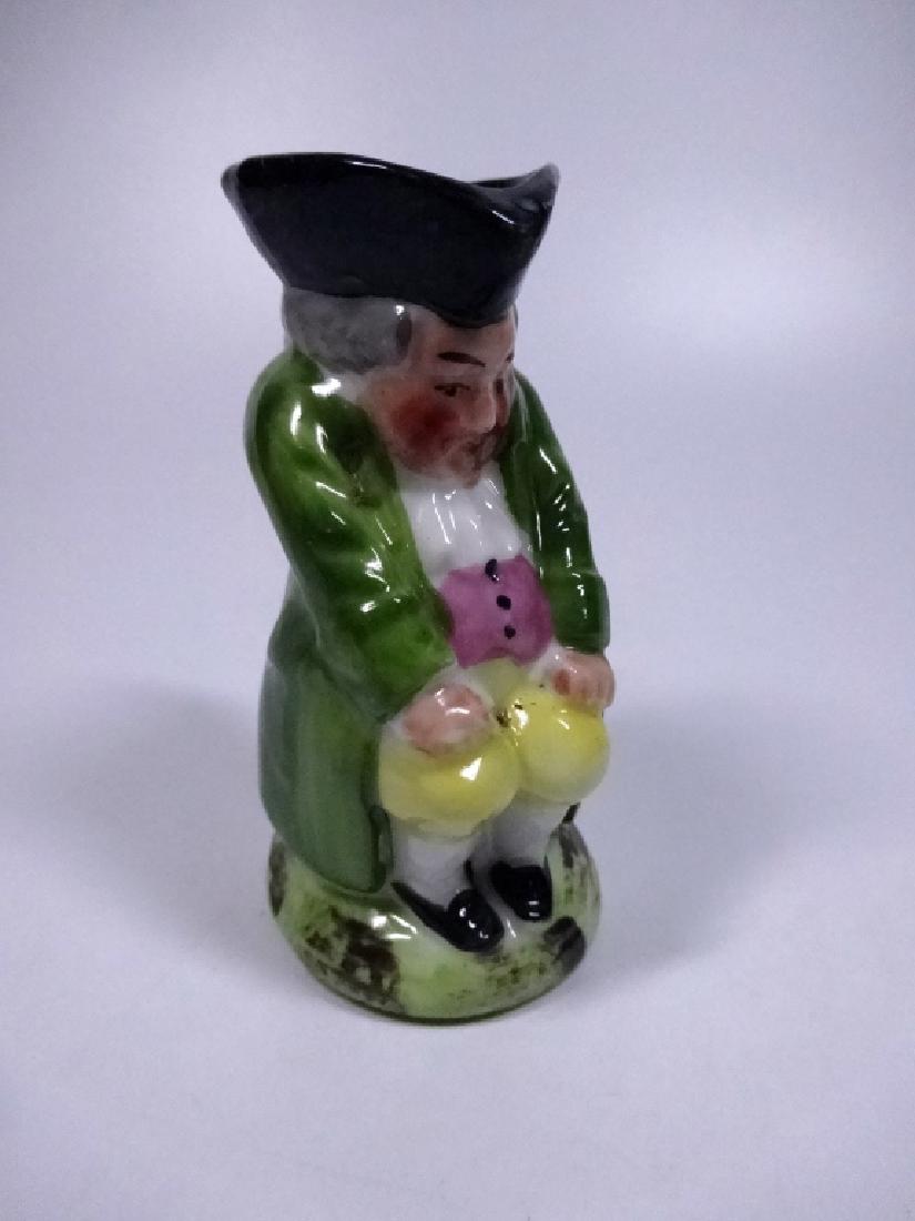 VINTAGE POTTERY TOBY JUG, SEATED MAN IN LIGHT GREEN: VINTAGE POTTERY TOBY JUG, SEATED MAN IN LIGHT GREEN COAT, APPROX 2 5/8"H