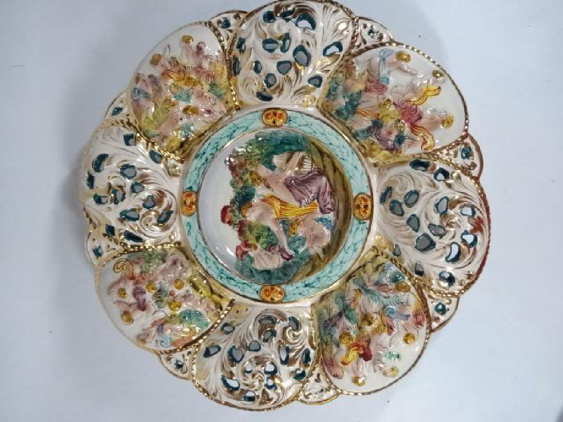 CAPODIMONTTE PORCELAIN HANDPAINTED PLATE, GILT ACCENTS,: CAPODIMONTTE PORCELAIN HANDPAINTED PLATE, GILT ACCENTS, PAINTED FIGURES AND FOLIATE DESIGNS, MARKED CAPODIMONTE ITALY, 14"W, SKU567