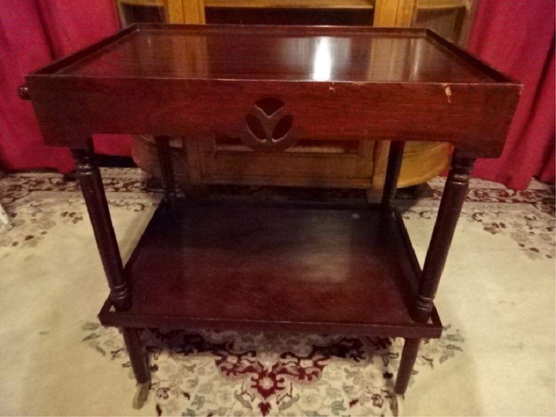 VINTAGE WOOD BAR CART ON CASTERS, MAHOGANY FINISH 2: VINTAGE WOOD BAR CART ON CASTERS, MAHOGANY FINISH 2 TIERS, GOOD VINTAGE CONDITION WITH MINOR WEAR AND SOME SMALL NICKS TO WOOD SEE PHOTOS, 28"H X 25.5"W X 16"D, SKU477.02