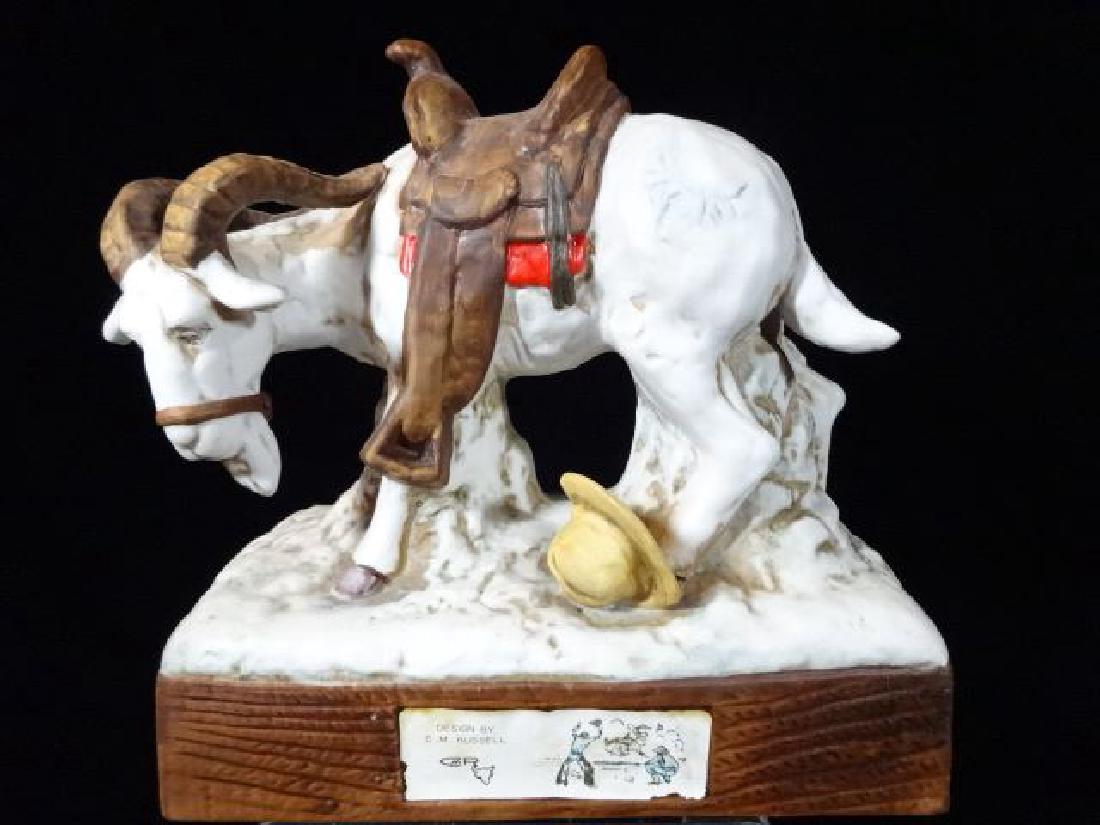 HOFFMAN CHARLES RUSSELL PORCELAIN DECANTER, "I RODE: HOFFMAN CHARLES RUSSELL PORCELAIN DECANTER, "I RODE HIM", GOAT WITH SADDLE, LABELED AND EMPTY, VERY GOOD CONDITION, APPROX 7" X 7", X 4", 575.07