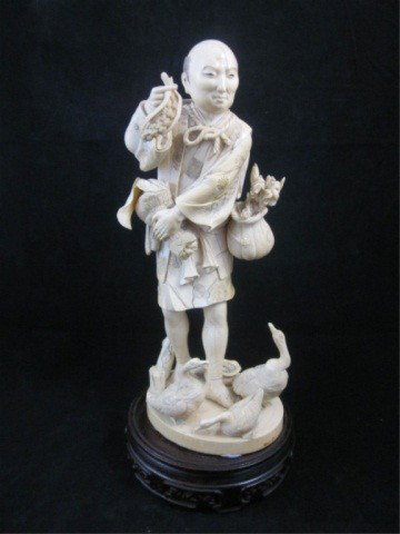 ANTIQUE IVORY FIGURINE OF A MAN FEEDING DUCKS, FINE: ANTIQUE IVORY FIGURINE OF A MAN FEEDING DUCKS, FINELY CARVED, APPEARS OF CHINESE OR JAPANESE ORIGIN, WITH BASE APPROX. 11" HIGH