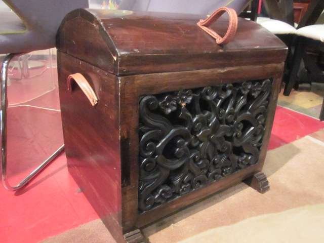 LARGE WOODEN CHEST IN DARK FINISH WITH INTRICATELY: LARGE WOODEN CHEST IN DARK FINISH WITH INTRICATELY CARVED PANEL AND LEATHER HANDLES, APPROX 30" LONG